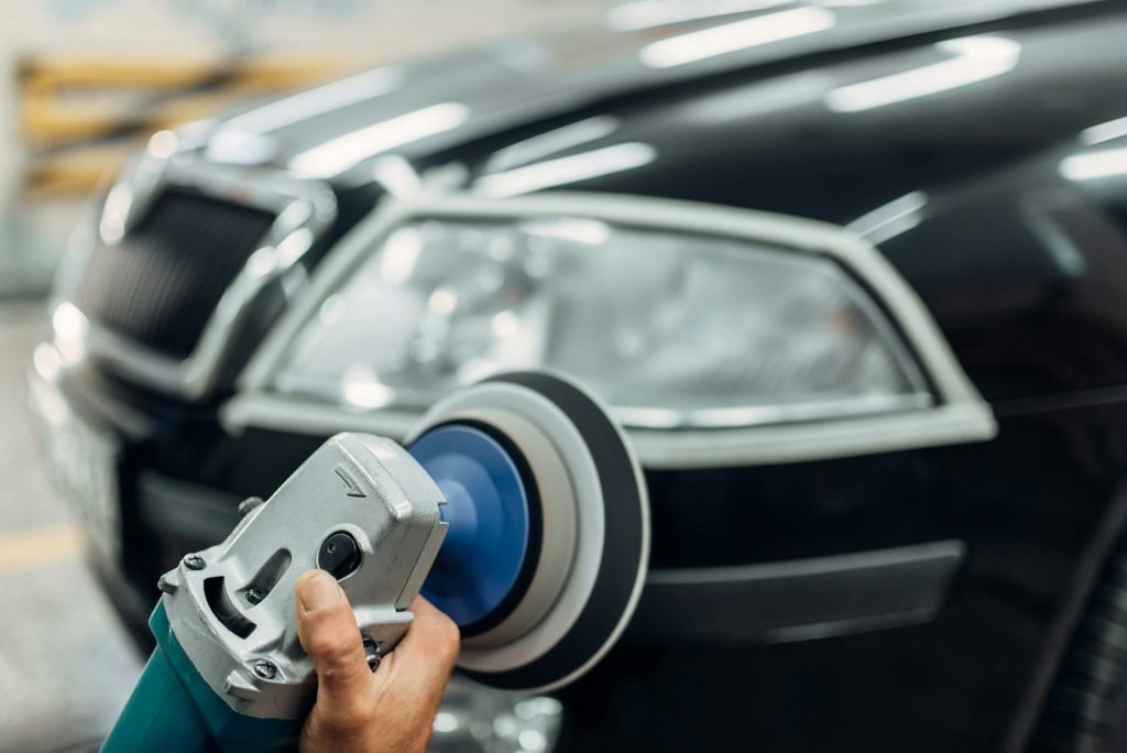 Detailing of car headlights with polishing machine